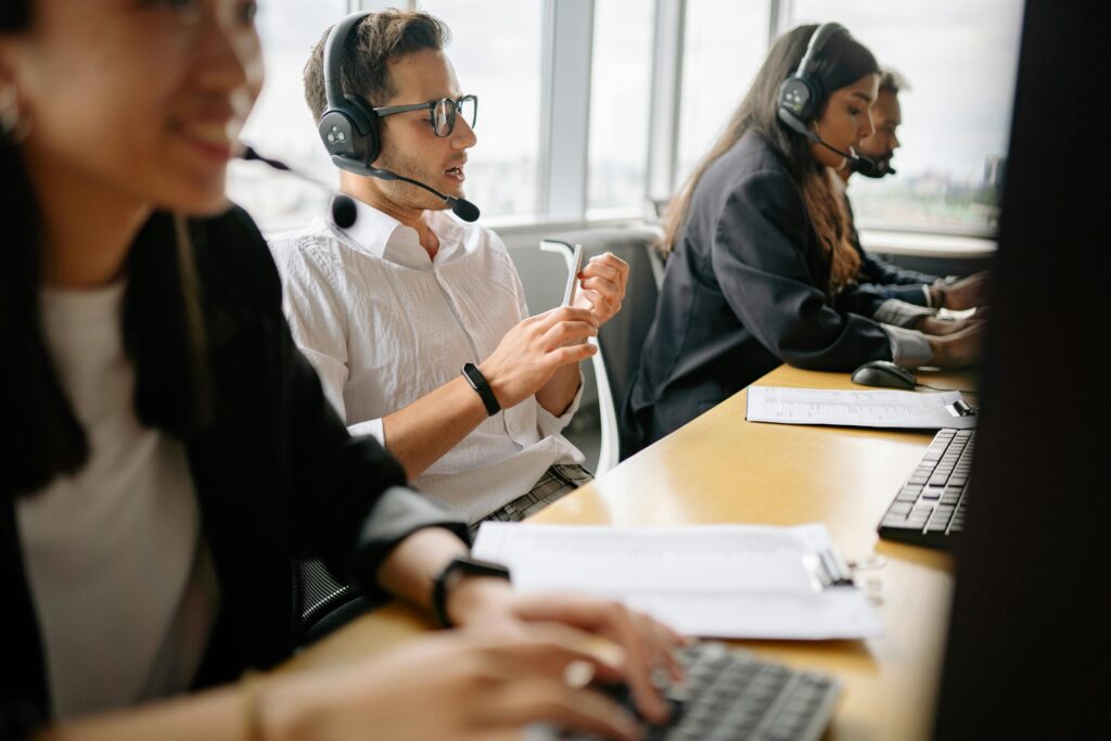 pexels-photo-8867261-8867261 A diverse team of call center agents working together in a modern office setting.